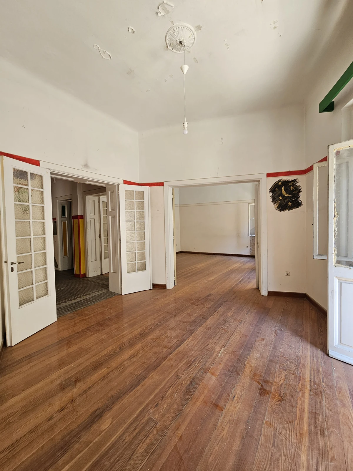 First floor, current condition — connecting rooms and glazed interior doors