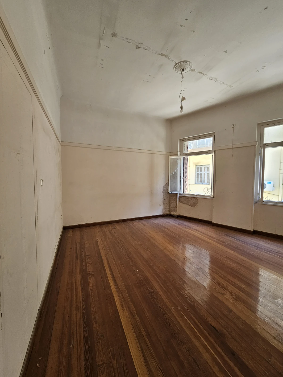 First floor, current condition — windowed room and existing ceiling finish